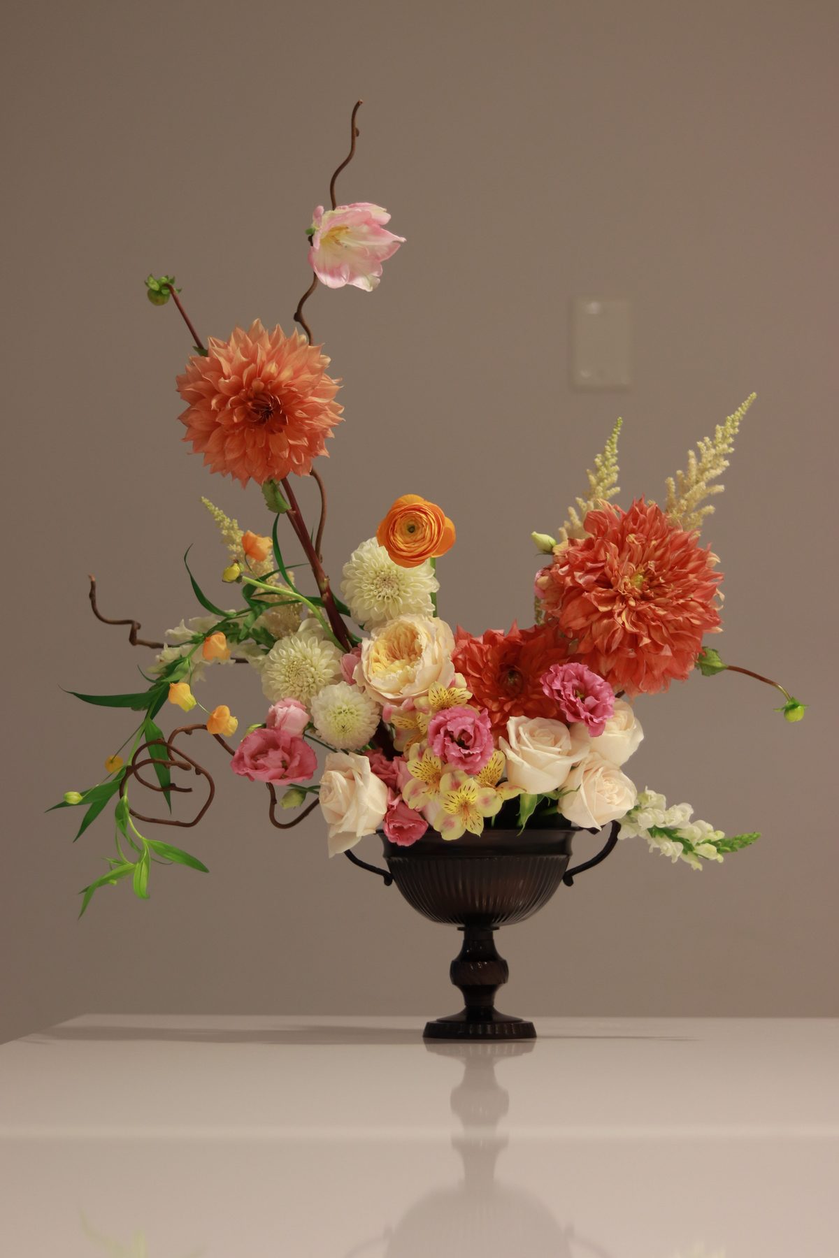 Sculptural dahlia arrangement with curly willow, alternate angle